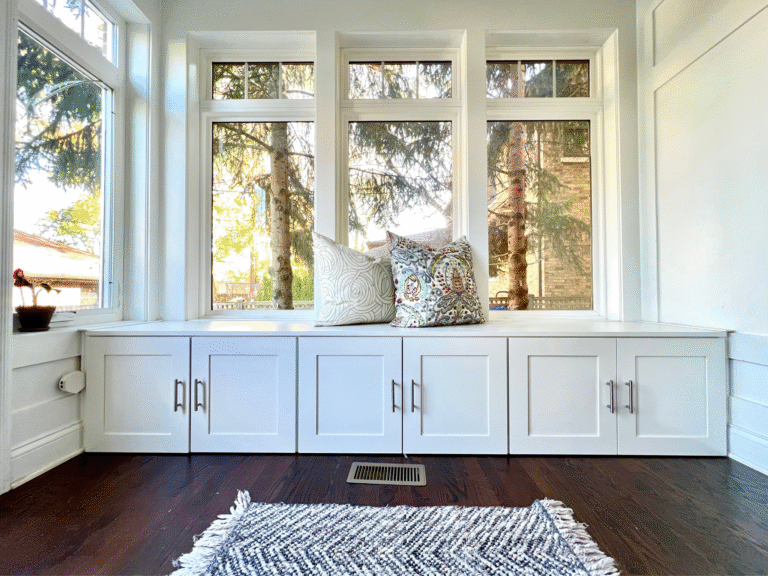 handcrafted Built-in mudroom cabinets with windows and decorative pillows